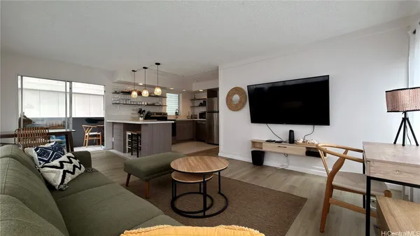 a living room with furniture and a flat screen tv