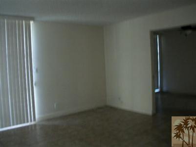42356 Dunes View Road, Unit 7 Rancho Mirage, CA 92270 - Photo 5 of 9 an empty room with windows