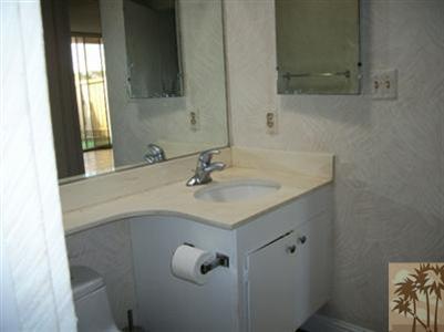 42356 Dunes View Road, Unit 7 Rancho Mirage, CA 92270 - Photo 6 of 9 a bathroom with a sink and a mirror