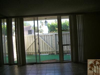 42356 Dunes View Road, Unit 7 Rancho Mirage, CA 92270 - Photo 7 of 9 a view of porch with a floor to ceiling window