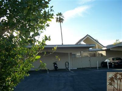 42356 Dunes View Road, Unit 7 Rancho Mirage, CA 92270 - Photo 9 of 9 a front view of a house with a yard