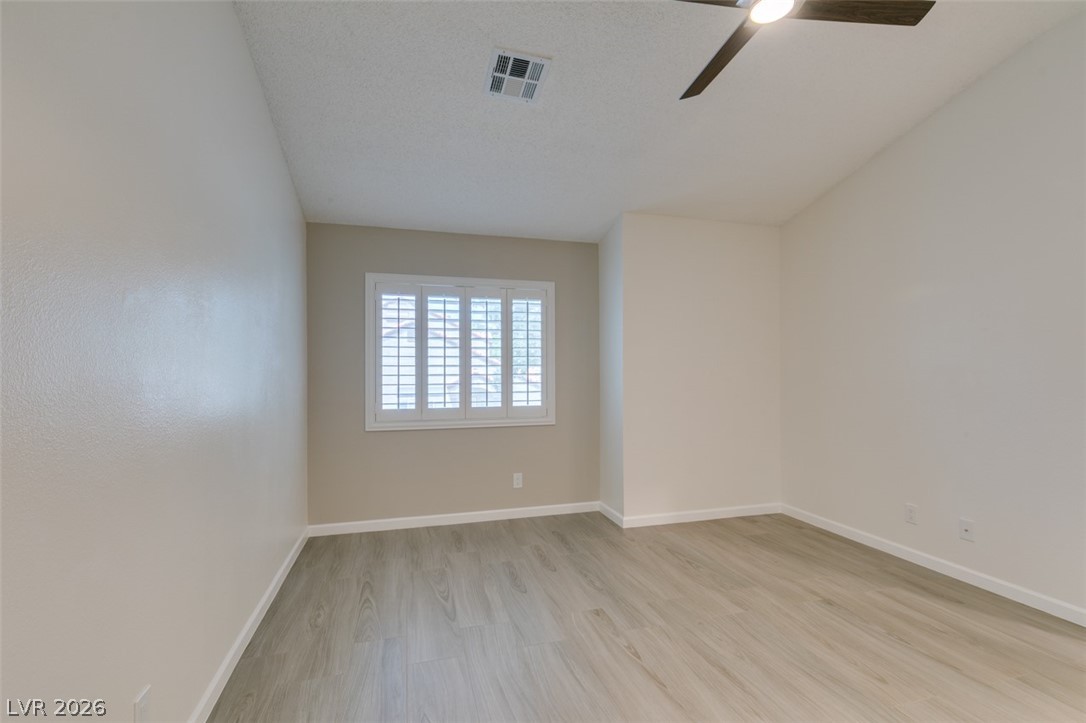 540 Sutters Mill Road Henderson, NV 89014 - Photo 36 of 46 This bright bedroom features durable flooring and a window with stylish shutters.