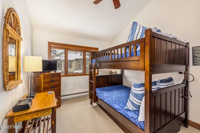 a bedroom with furniture and a window