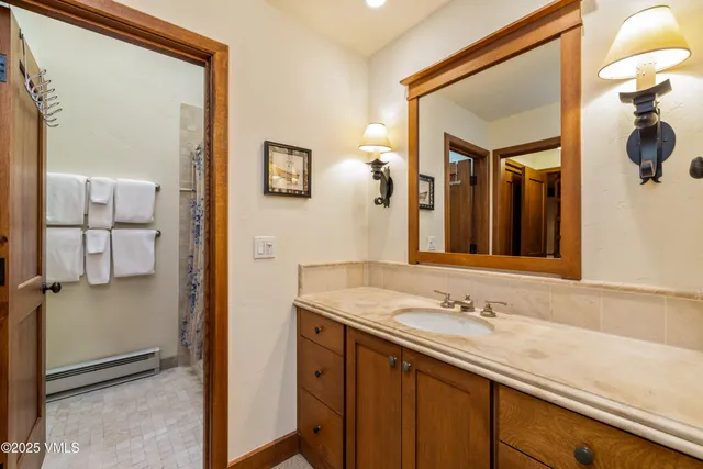 a bathroom with a sink and a mirror