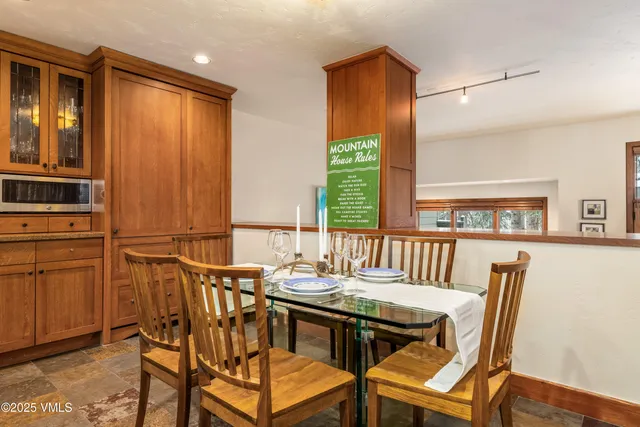 a dining room with furniture and window