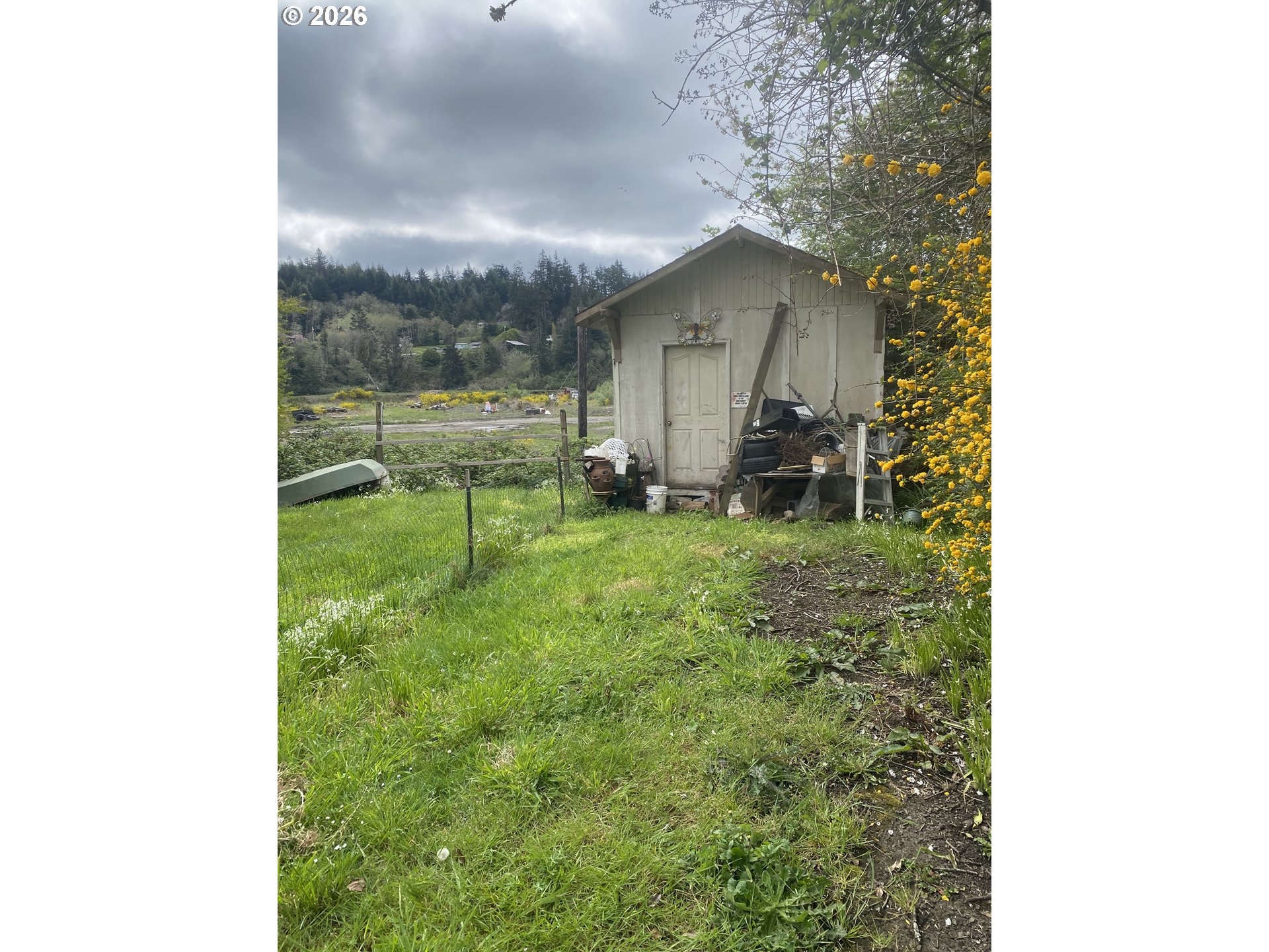 93840 High Lane Coos Bay, OR 97420 - Photo 5 of 7 a backyard of a house with table and chairs