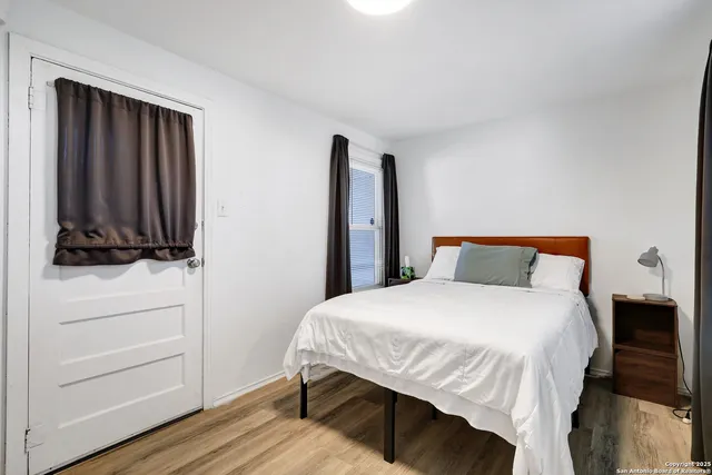 a bedroom with a bed and a dresser