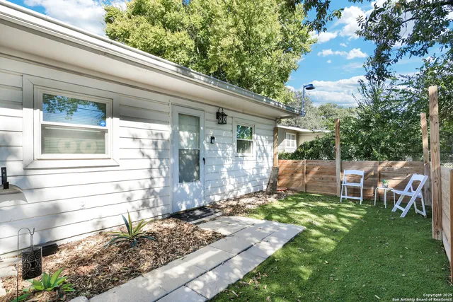 a view of a back yard of the house
