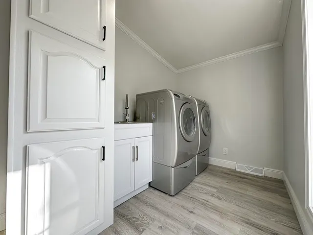 a utility room with dryer and washer