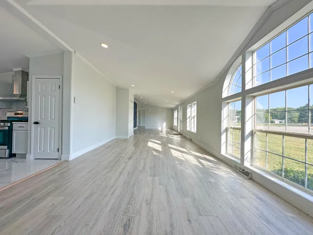 a view of gallery with wooden floor