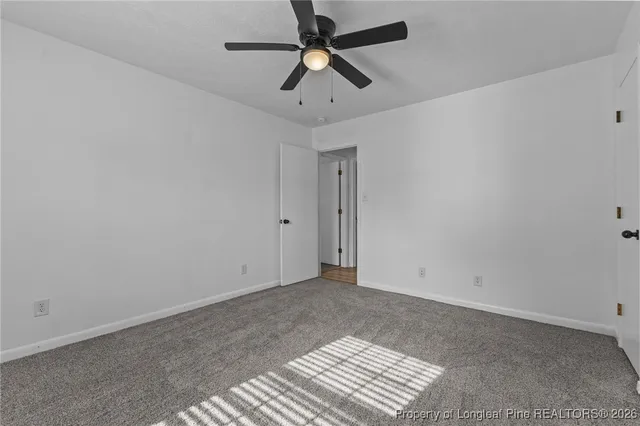 a view of room with a ceiling fan