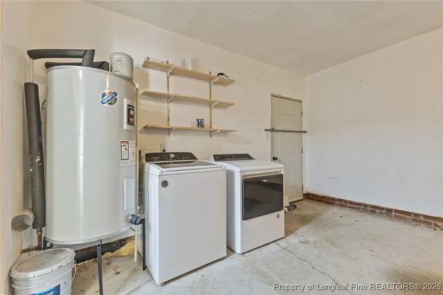 a view of storage and utility room with washer and dryer