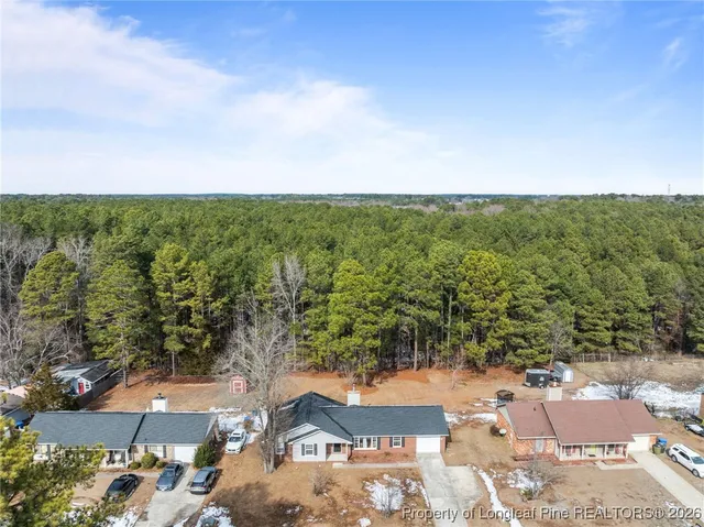 an aerial view of residential house with outdoor space