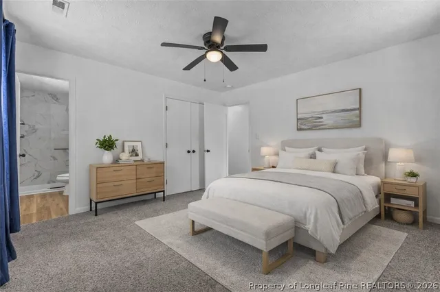 a bedroom with a bed and a couch