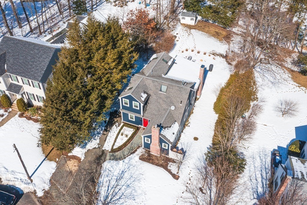 a view of a house with a snow in the forest