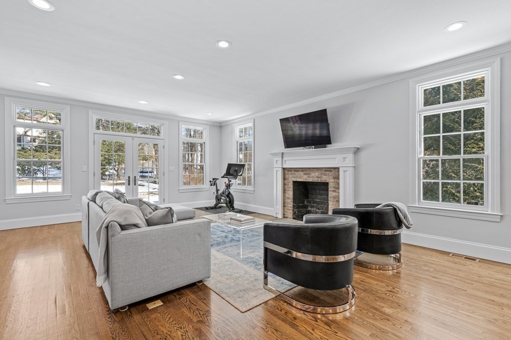 71 Fuller Brook Road Wellesley, MA 02482 - Photo 13 of 24 a living room with furniture and a flat screen tv