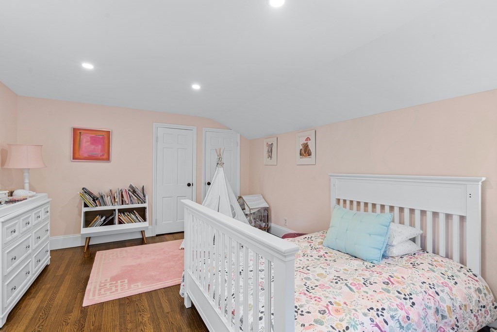 71 Fuller Brook Road Wellesley, MA 02482 - Photo 18 of 24 a bedroom with furniture and a wooden floor