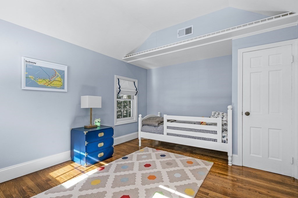 71 Fuller Brook Road Wellesley, MA 02482 - Photo 19 of 24 a bedroom with a bed and a bookshelf
