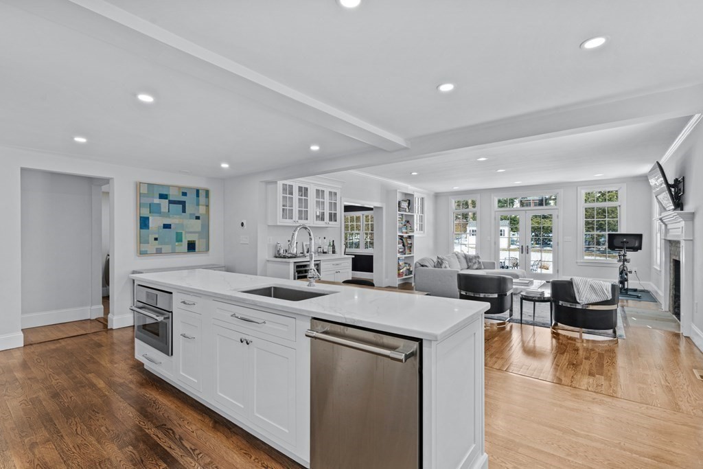 71 Fuller Brook Road Wellesley, MA 02482 - Photo 6 of 24 a kitchen with a sink stove and wooden floor