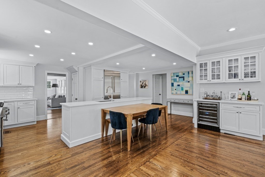 71 Fuller Brook Road Wellesley, MA 02482 - Photo 9 of 24 a kitchen with stainless steel appliances granite countertop a stove a sink dishwasher and a refrigerator with wooden floor
