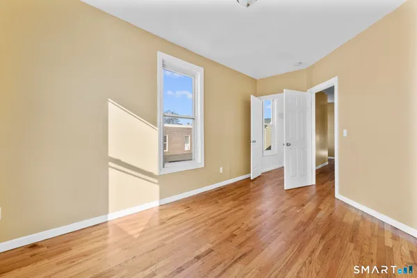 a view of a livingroom with wooden floor