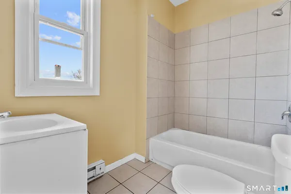a bathroom with a toilet sink and bathtub