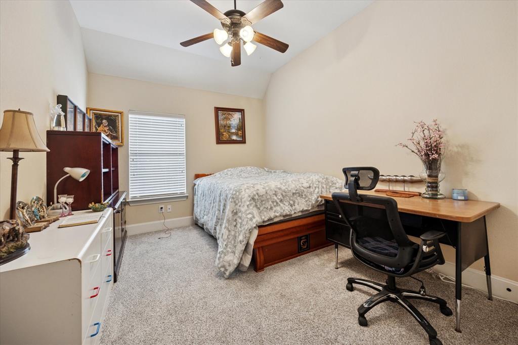 119 George Owens Road Ponder, TX 76259 - Photo 15 of 26 Carpeted room with a vaulted ceiling, a ceiling fan, and a single window with blinds