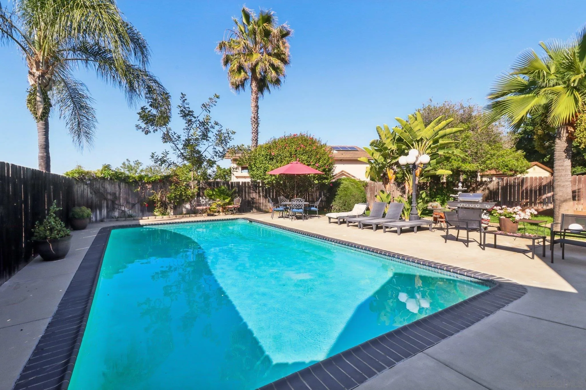 10420 Loma Rancho Drive Spring Valley, CA 91978 - Photo 23 of 41 a view of a swimming pool with a yard