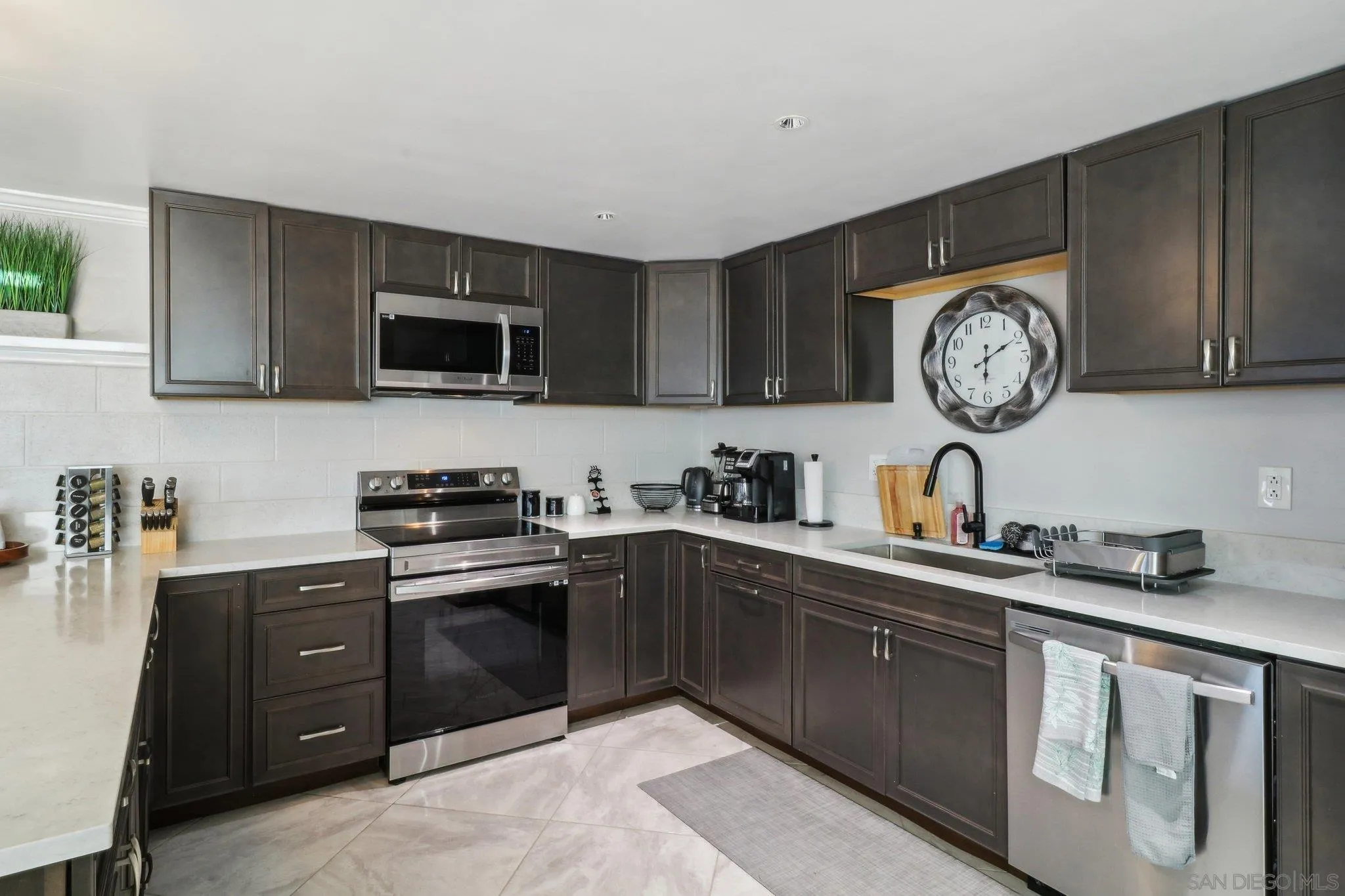 10420 Loma Rancho Drive Spring Valley, CA 91978 - Photo 32 of 41 a kitchen with a sink cabinets and stainless steel appliances