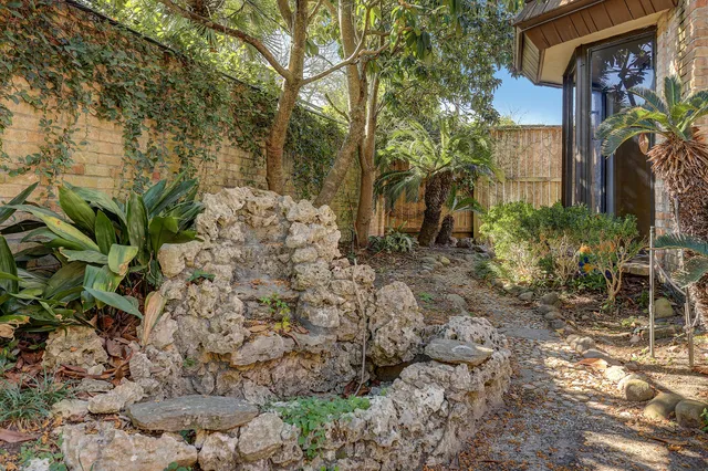 a view of a house with a small yard