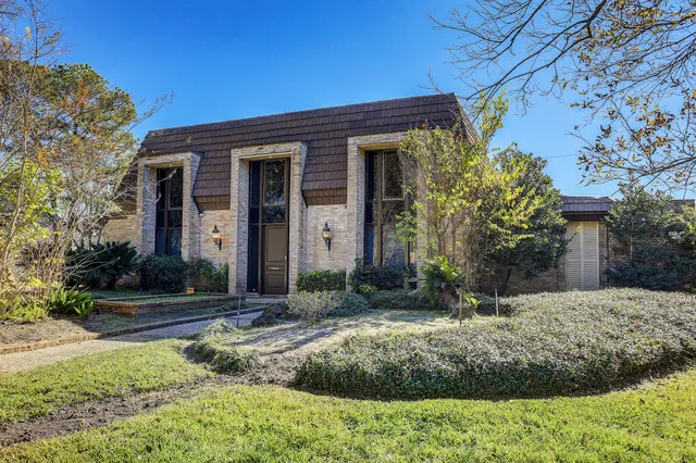a view of a outdoor space with patio furniture and potted plants