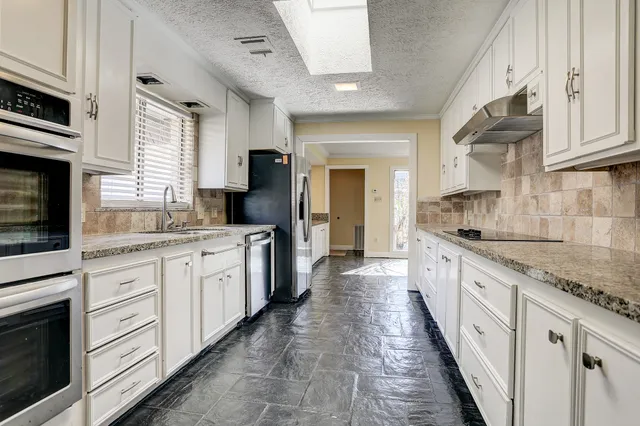 a large kitchen with cabinets