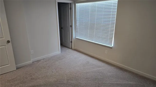 a view of a room that has a window in it