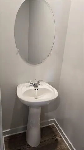 a bathroom with a sink and mirror