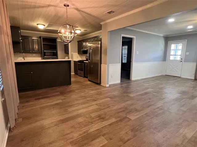 a view of a kitchen and a window