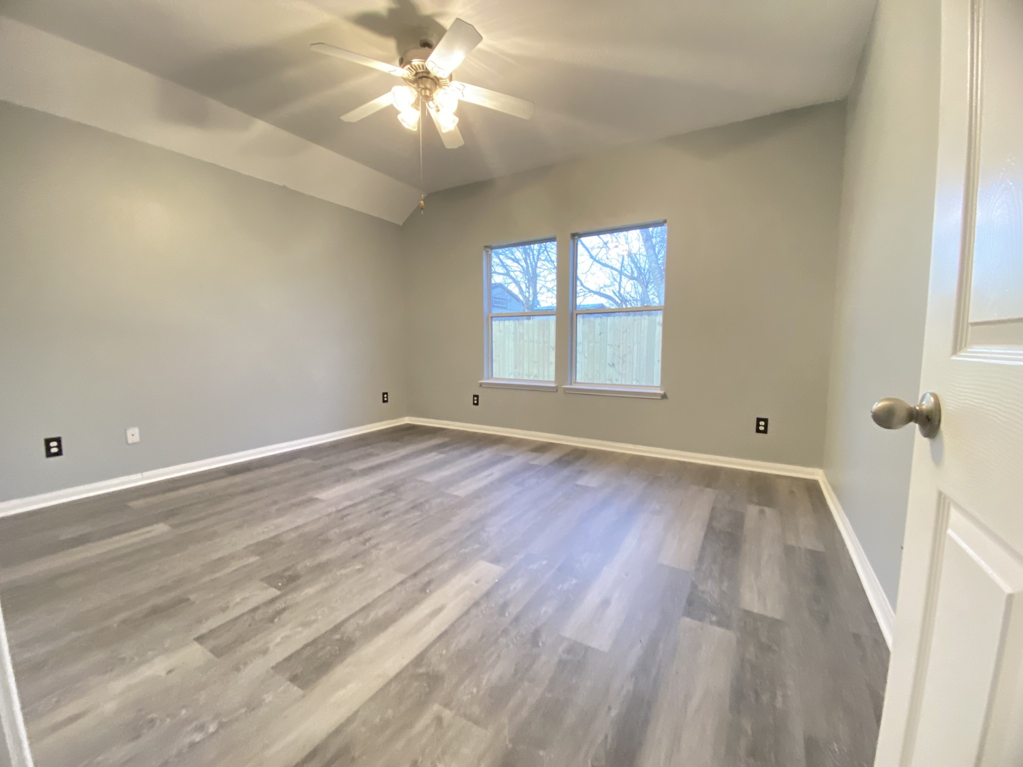 4031 Raspberry Court Dickinson, TX 77539 - Photo 13 of 24 a view of empty room with wooden floor and fan