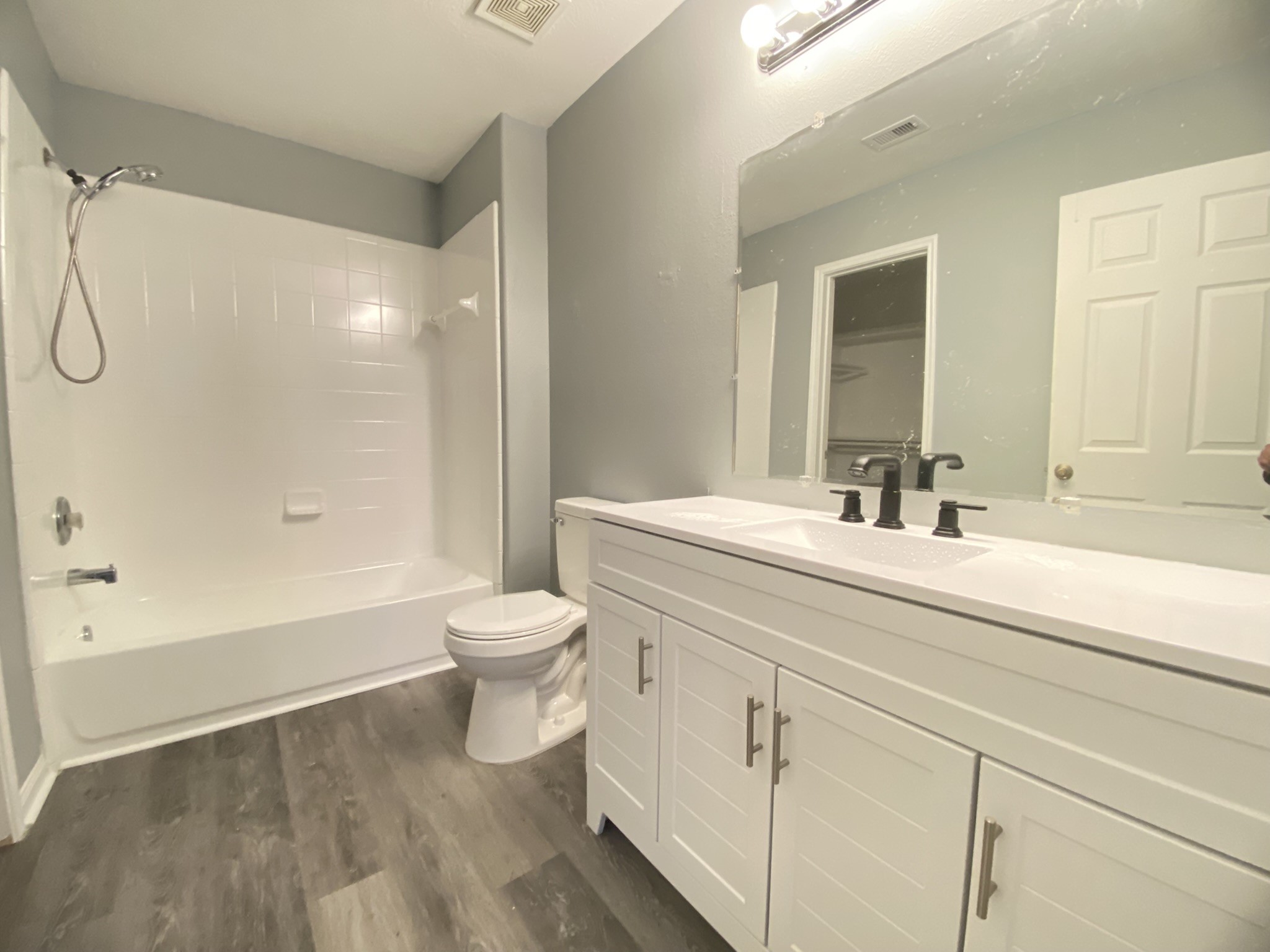 4031 Raspberry Court Dickinson, TX 77539 - Photo 15 of 24 a bathroom with a double vanity sink toilet and shower