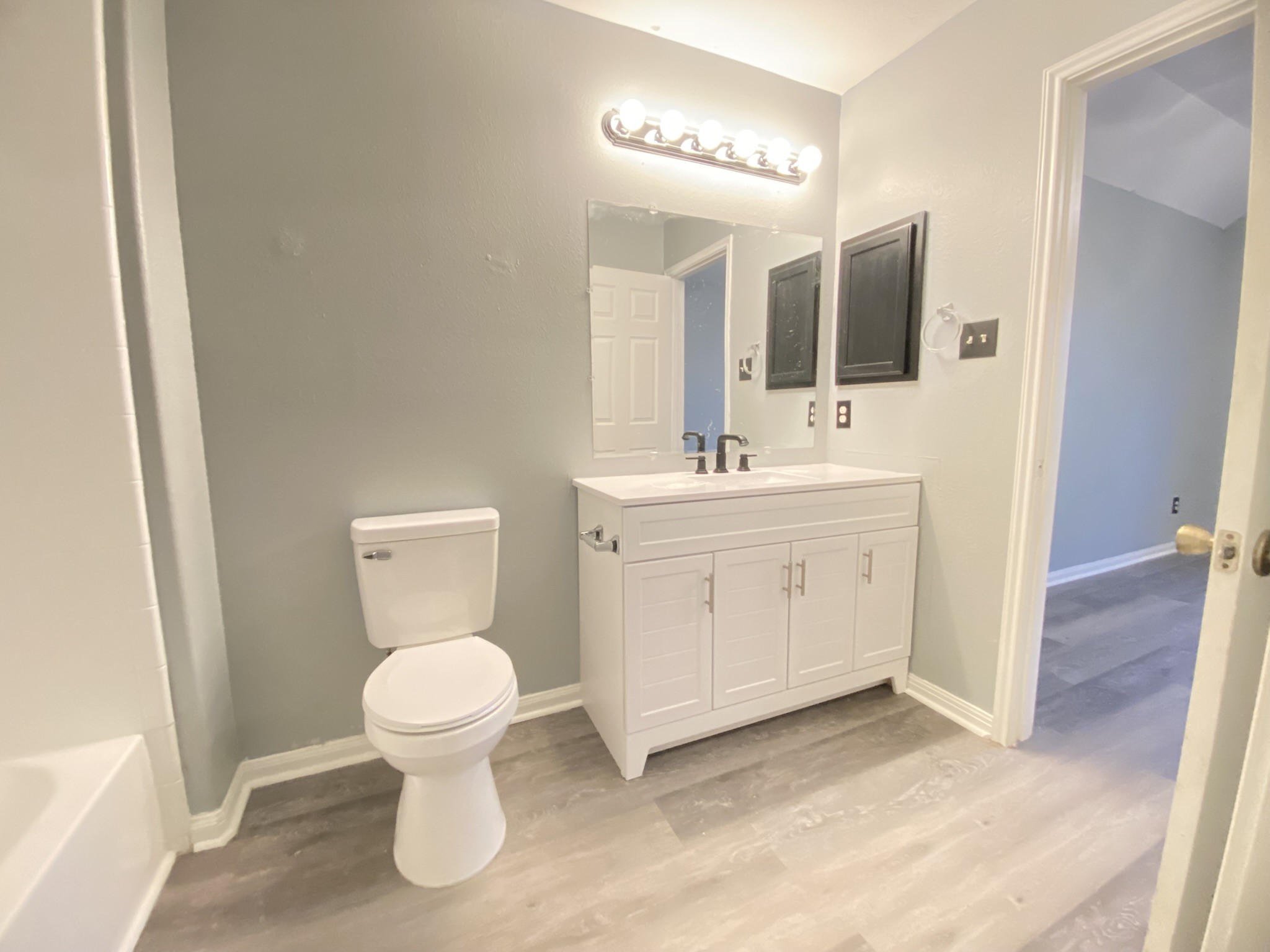 4031 Raspberry Court Dickinson, TX 77539 - Photo 17 of 24 a bathroom with a toilet sink and mirror