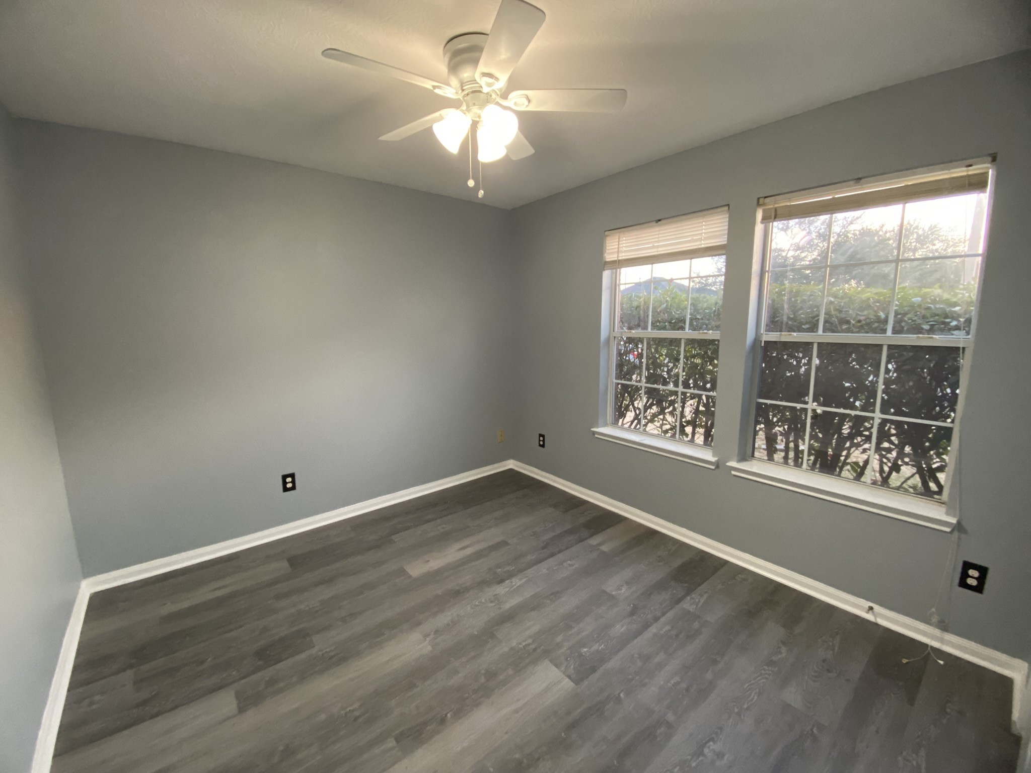 4031 Raspberry Court Dickinson, TX 77539 - Photo 20 of 24 an empty room with wooden floor and windows