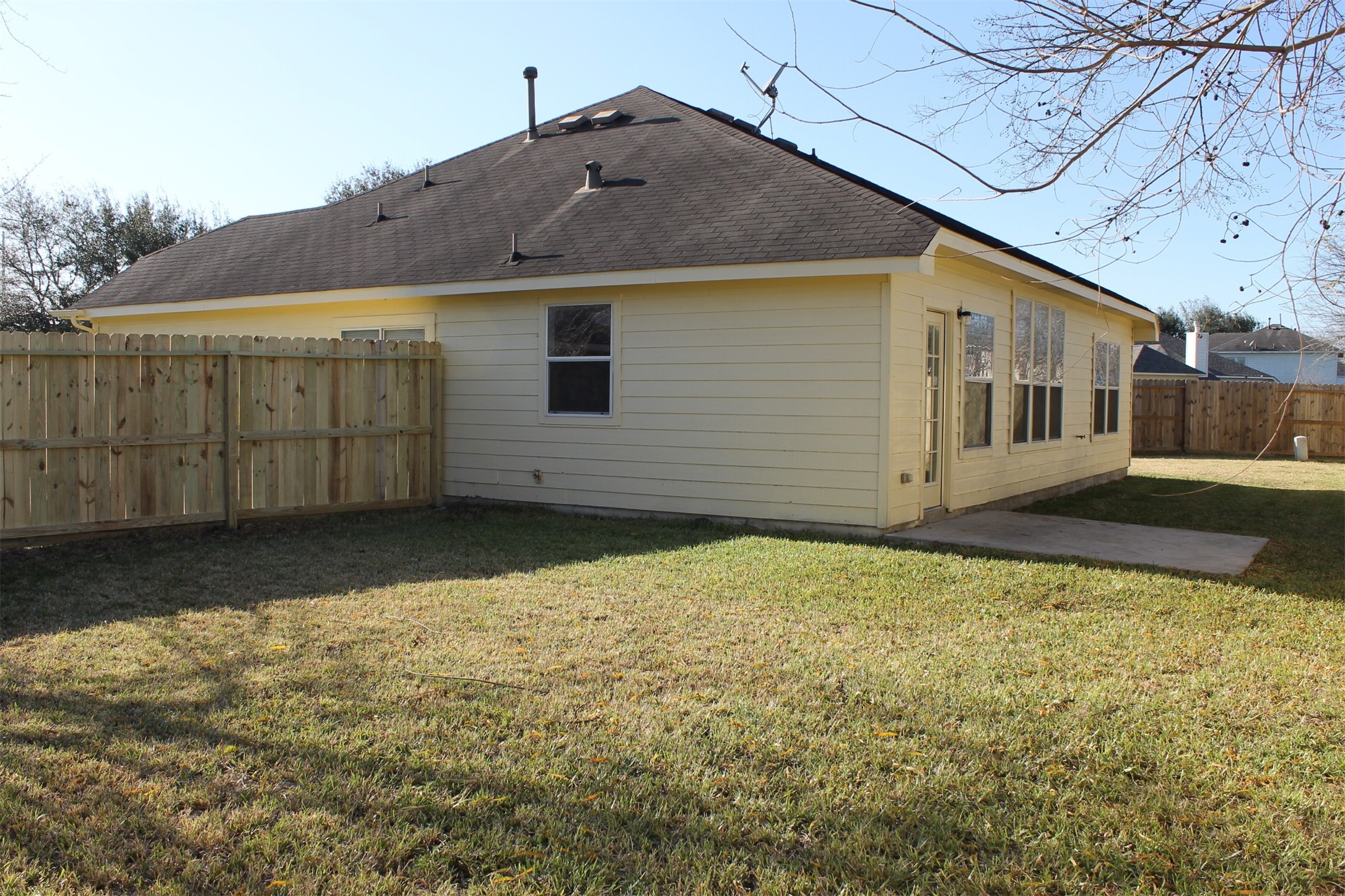 4031 Raspberry Court Dickinson, TX 77539 - Photo 22 of 24 a view of a house with a wooden fence