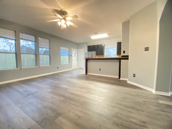 a view of a kitchen with a sink and a window