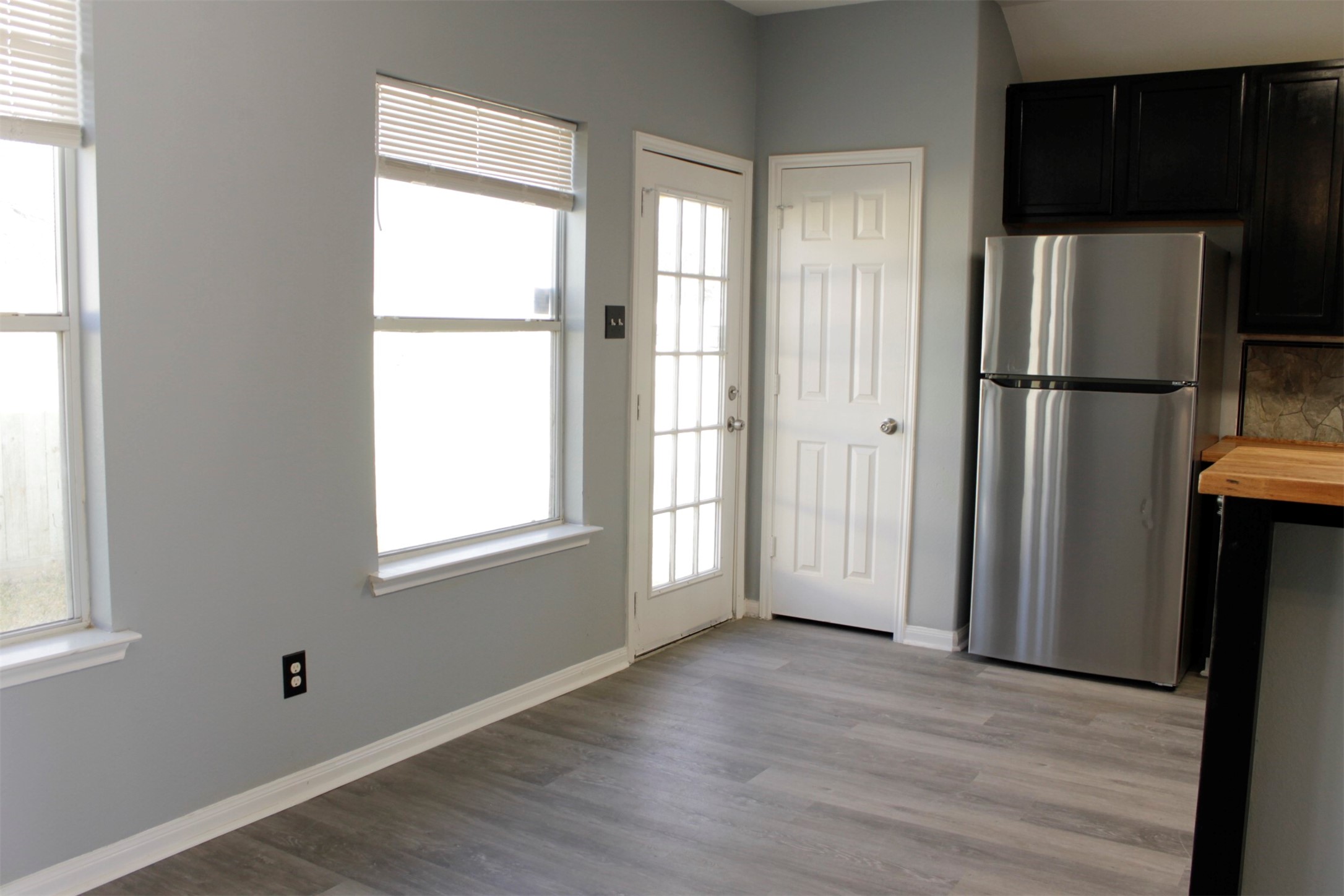 4031 Raspberry Court Dickinson, TX 77539 - Photo 10 of 24 a view of an empty room with a window and wooden floor