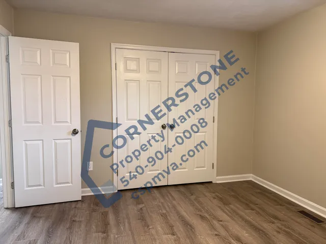 a bathroom with a sink a toilet and a shower