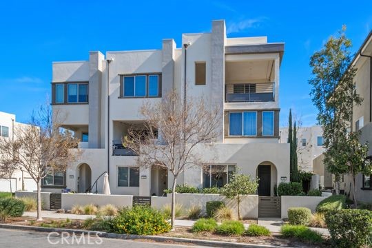 a front view of a building with garden