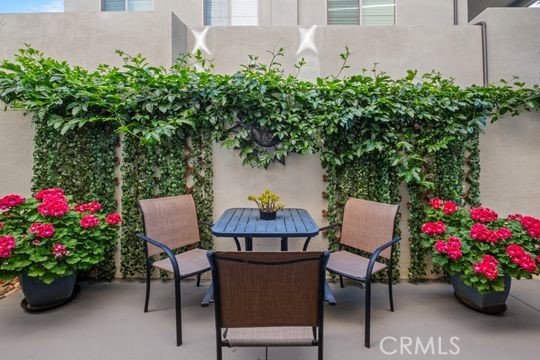 165 Frame Irvine, CA 92618 - Photo 12 of 37 a view of a table and chairs in a garden