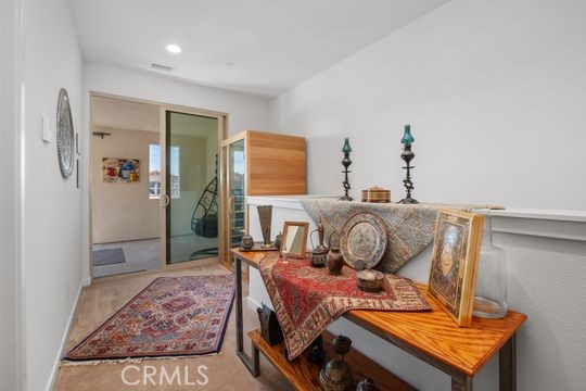 165 Frame Irvine, CA 92618 - Photo 17 of 37 a bedroom with a bed and wooden floor