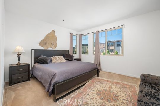 165 Frame Irvine, CA 92618 - Photo 18 of 37 a bedroom with a bed and a painting on the wall