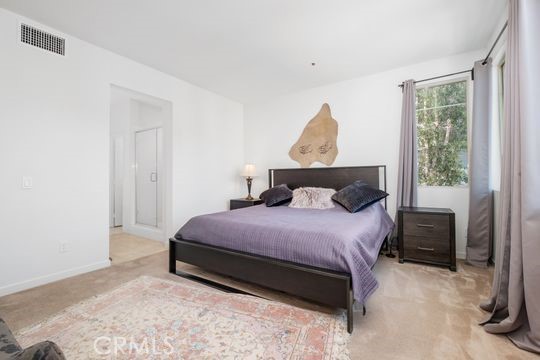 165 Frame Irvine, CA 92618 - Photo 19 of 37 a bedroom with a bed and window