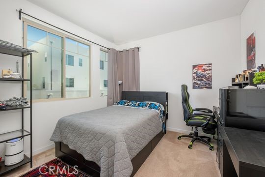 165 Frame Irvine, CA 92618 - Photo 22 of 37 a bedroom with a bed and furniture