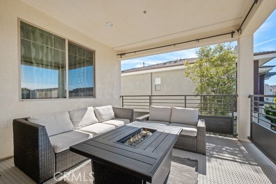 165 Frame Irvine, CA 92618 - Photo 27 of 37 a living room with furniture and a floor to ceiling window